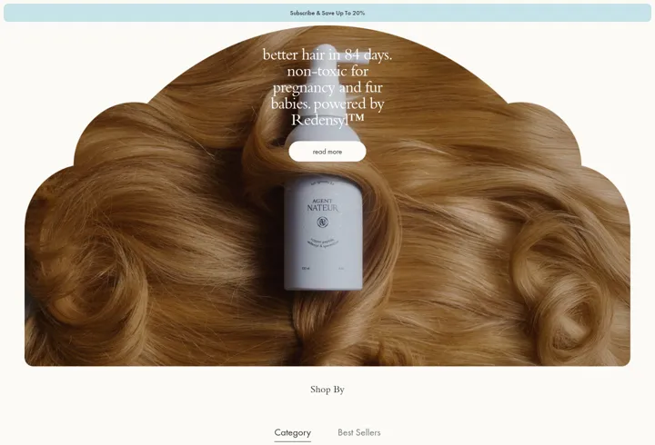 Agent Nateur website featuring a product set against golden hair